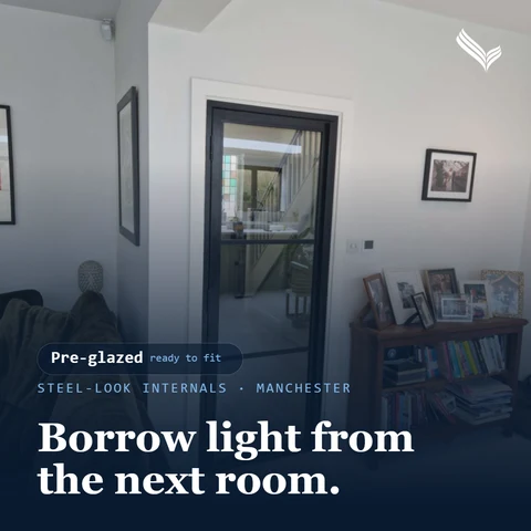 Promo card: black steel-look internal door seen from a living room; headline 'Borrow light from the next room.'