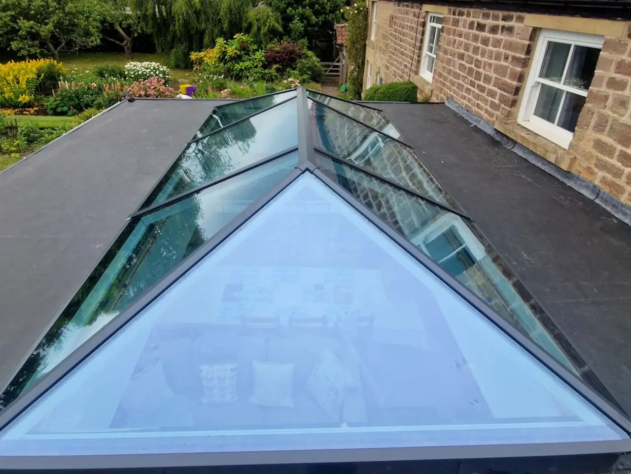 Aluminium roof lantern over a stone extension, seen from the roof