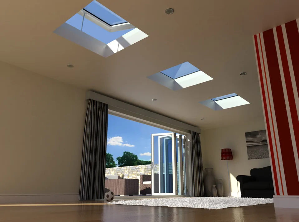 Three flat rooflights, the nearest propped open, over a living room with white bifold doors folded back to a terrace